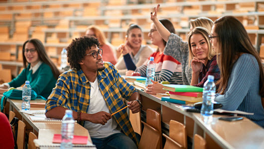 students sitting in a classroom talking