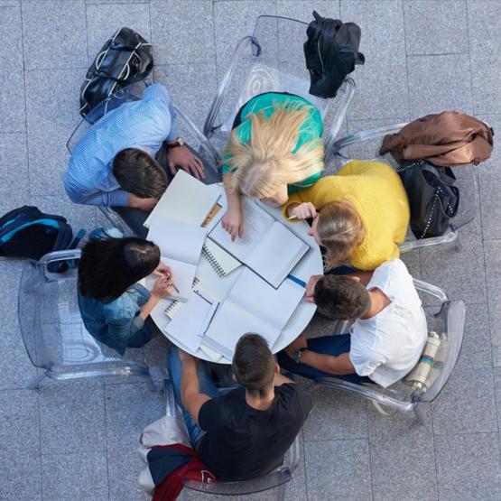 overhead view of students sharing a round table