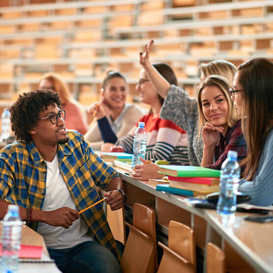 students sitting in a classroom talking